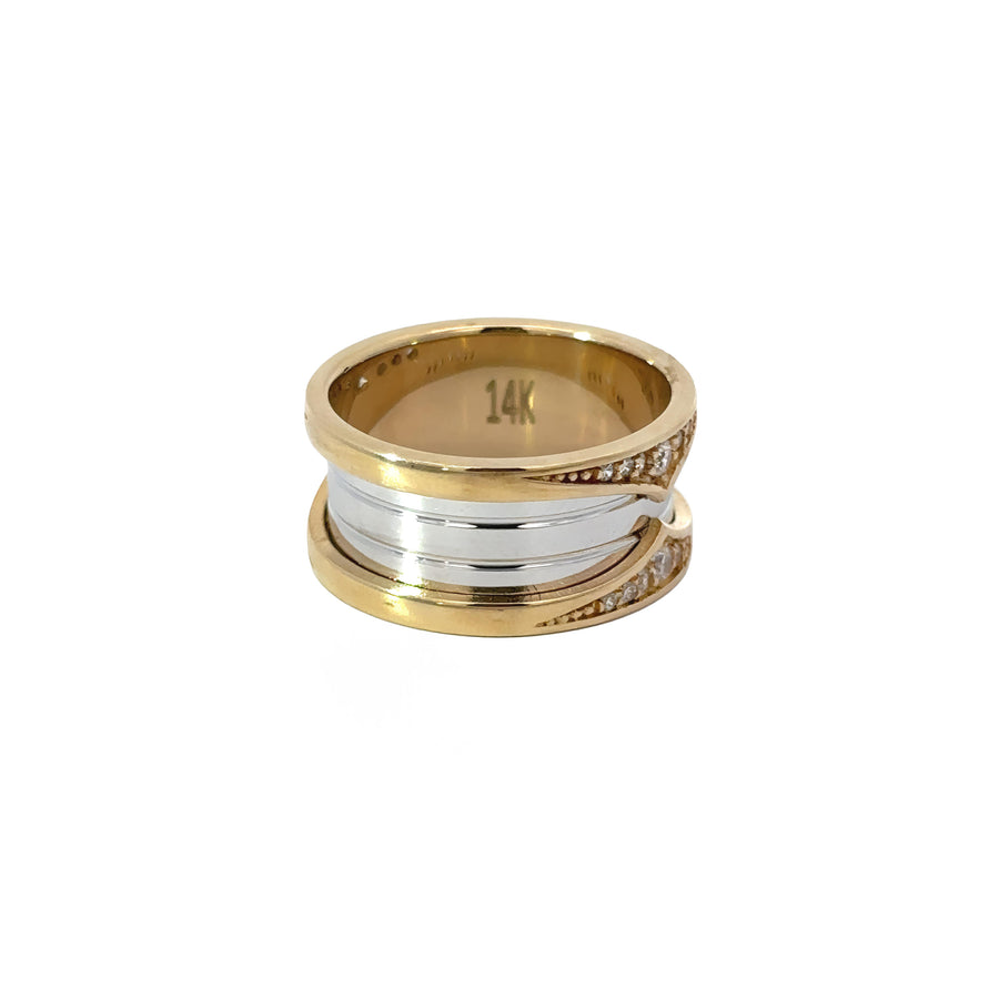 Side view of two-tone 14k gold ring with central CZ