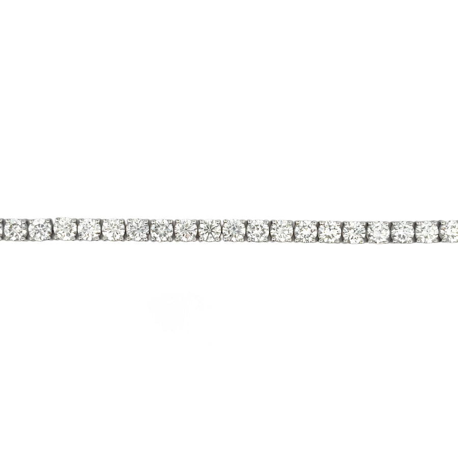 White gold diamond bracelet laid flat against white background