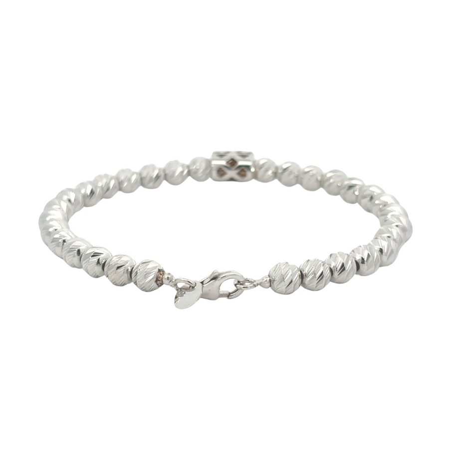 Close-up of braided pattern on white gold bracelet