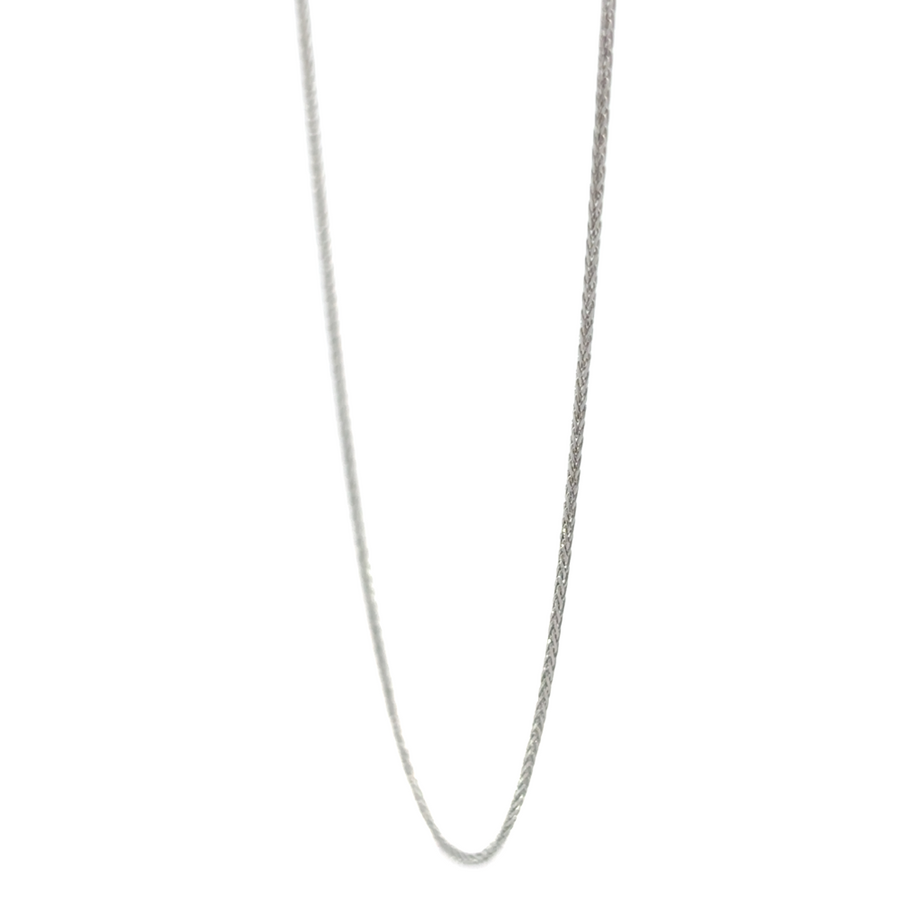 Chain displayed on a black velvet tray, highlighting white gold shine