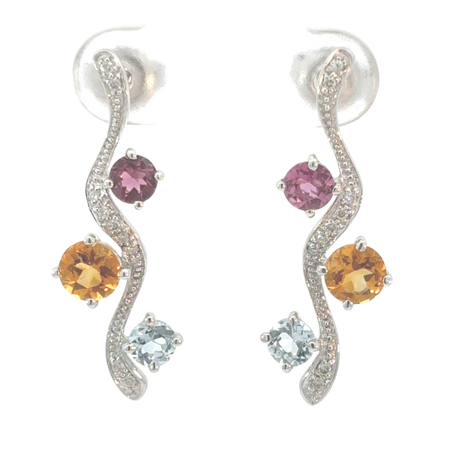 14k white gold earrings with three diamonds on white background