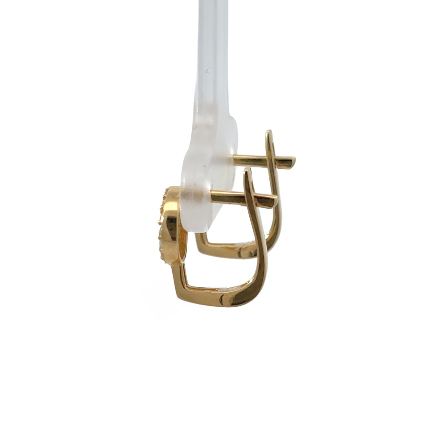 Pair of 14k white gold earrings displayed on white background