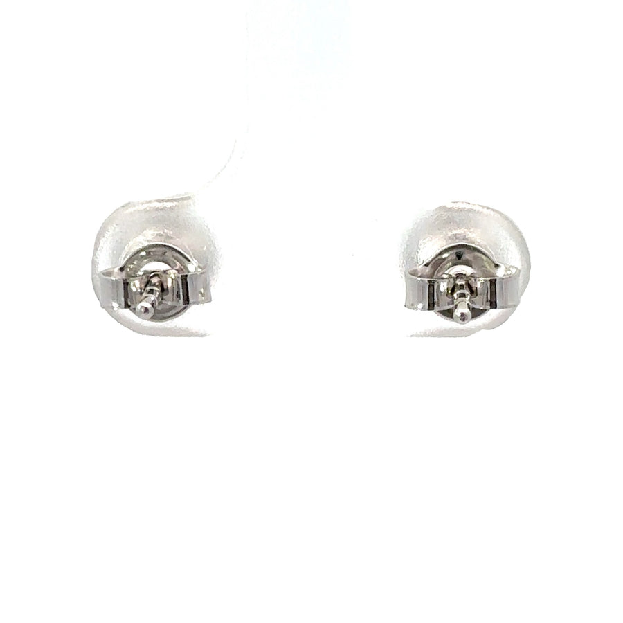 Woman wearing 14k white gold ball studs with a casual outfit