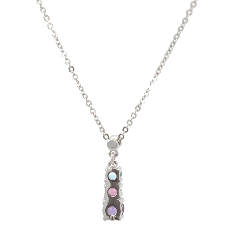 Close-up of 3 sparkling stones on white gold chain