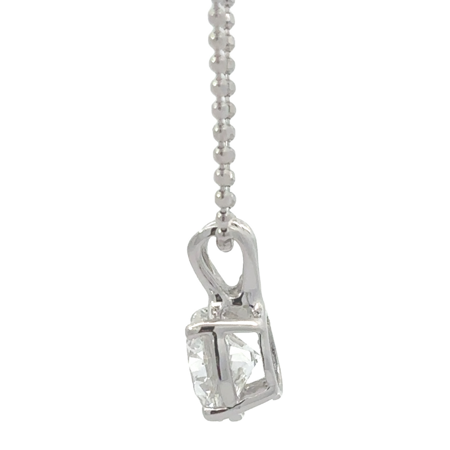 Close-up of 14k white gold pendant with 1.02 CT lab diamond, crafted for modern luxury.