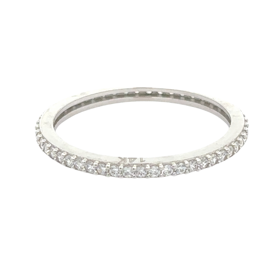 Close-up of 14k white gold ring with full CZ stones on white background