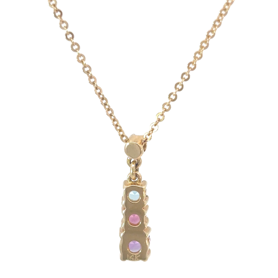 Women’s gold necklace with golden chain and three gems