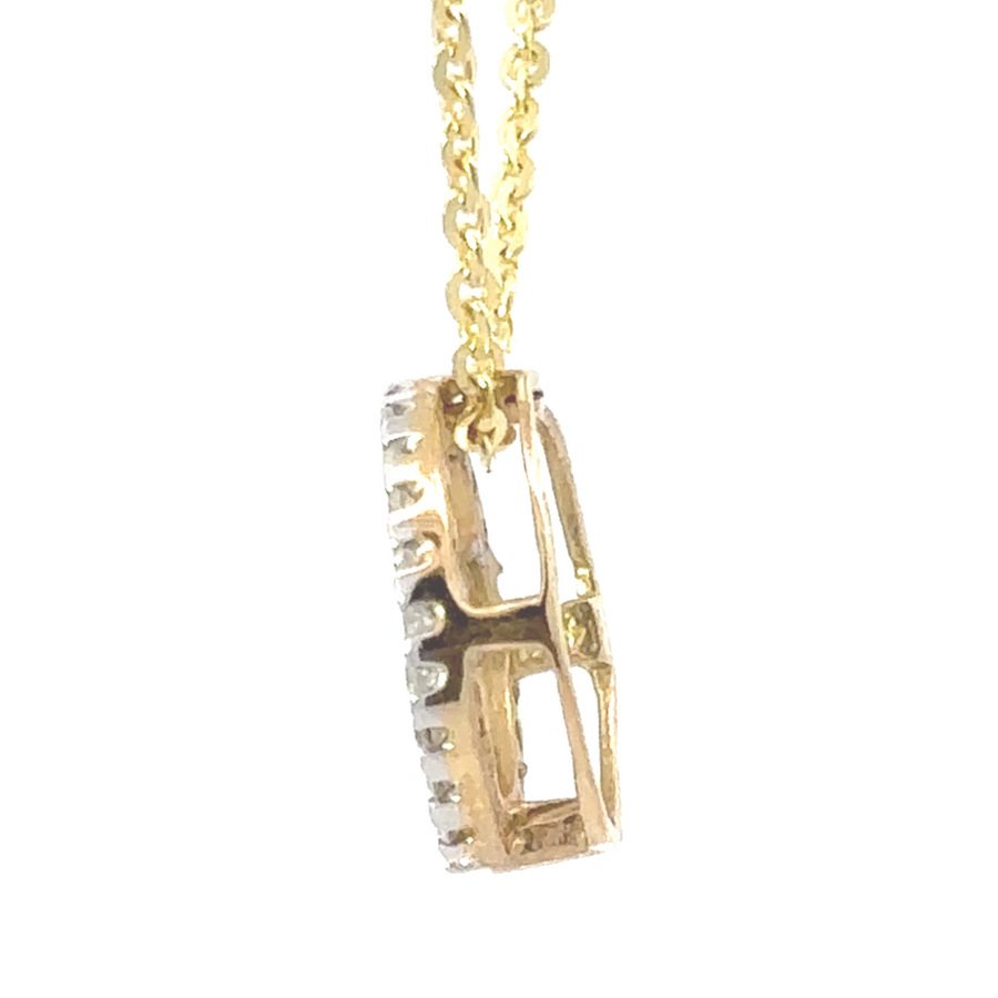 Minimalist 14k yellow gold pendant with diamond accents