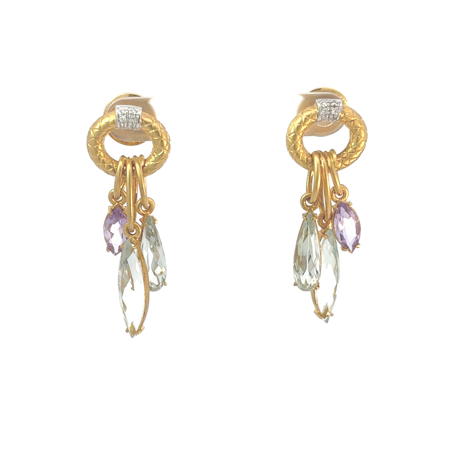 Close-up of 18K gold earrings with amethyst gemstone for women
