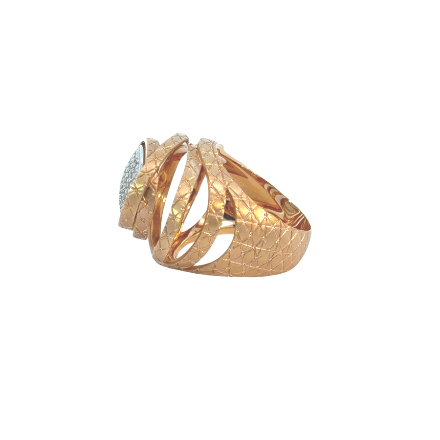 Side angle of 18K gold ring showcasing diamond details