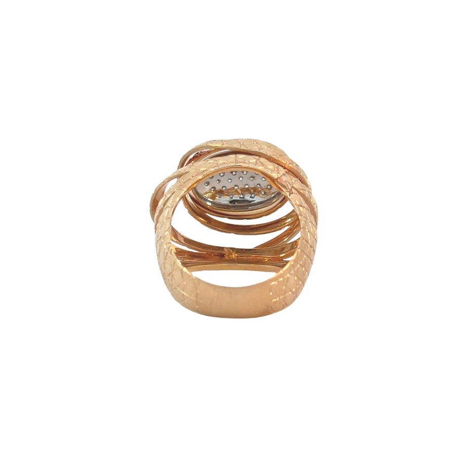 Luxurious two-tone gold ring with sparkling diamonds on display