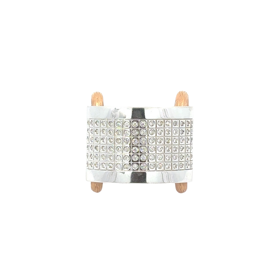Close-up of elegant women’s gold ring in white and yellow tones