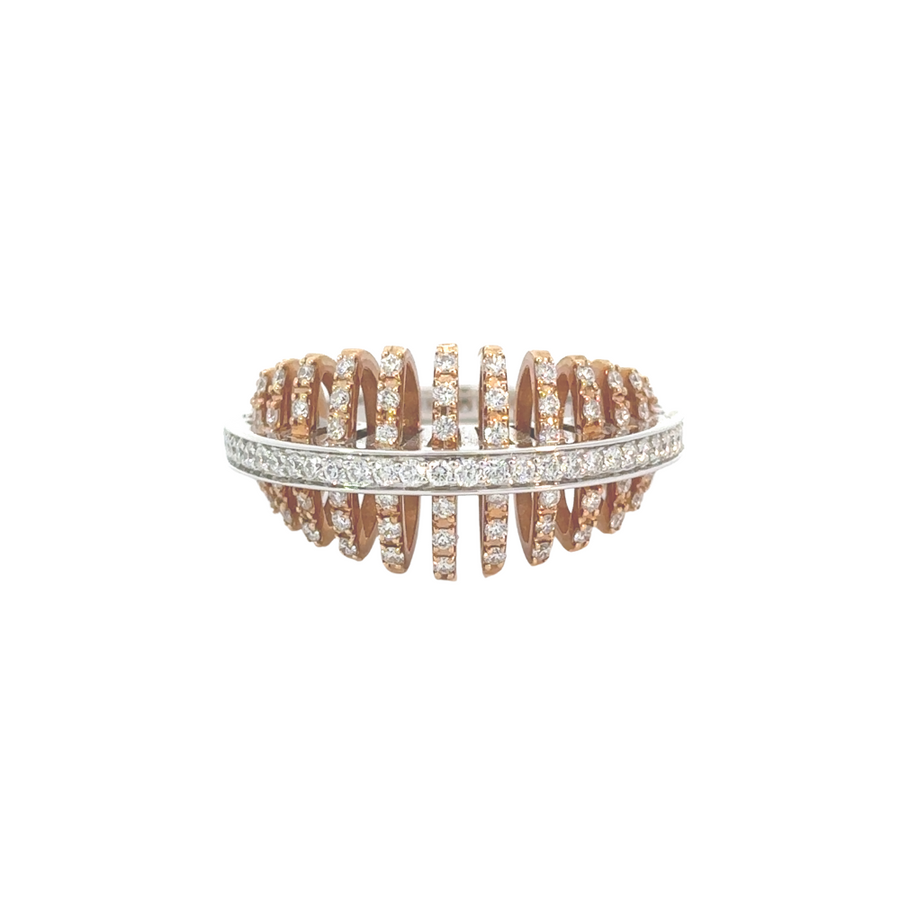 Close-up of 18K white and yellow gold women's ring with diamond accents