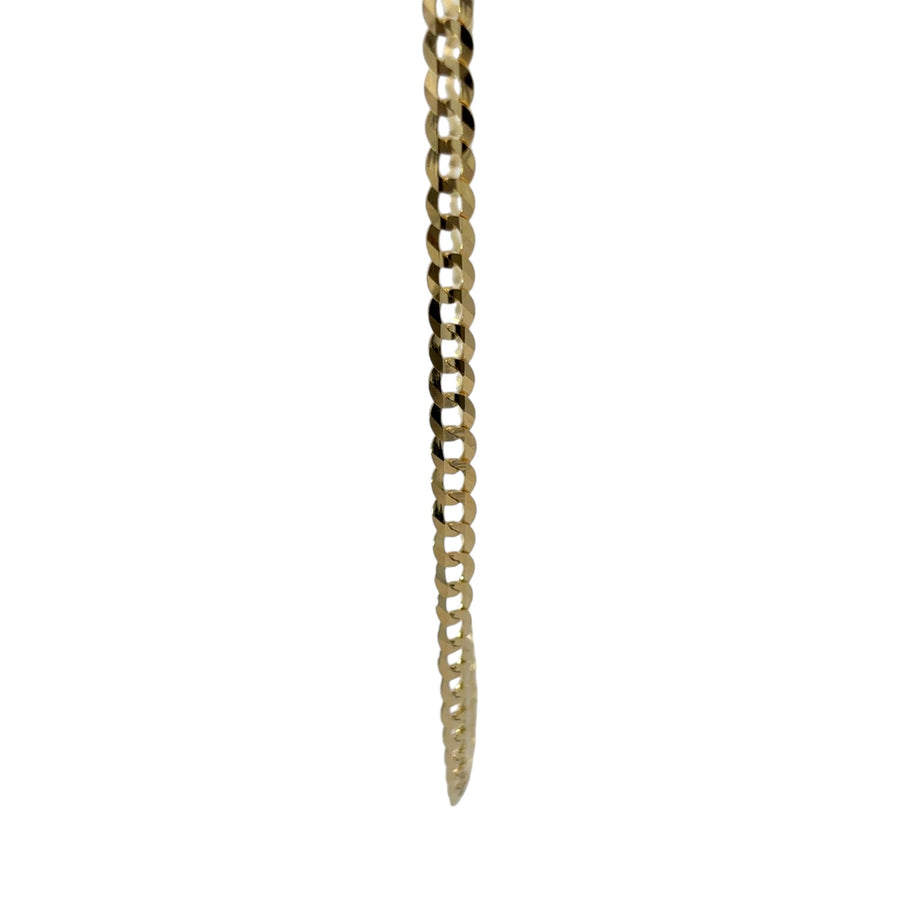 Close-up of 14k gold Cuban link chain detailing