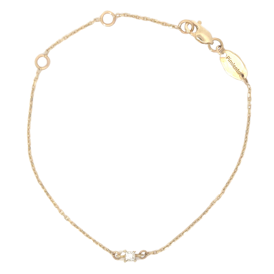 Close-up of the 18k gold bracelet showing its adjustable links and radiant finish.