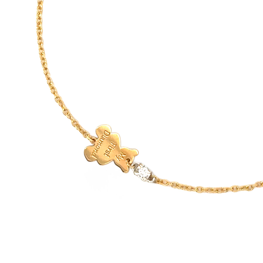 Baby wearing elegant 18k gold bracelet with diamond accent