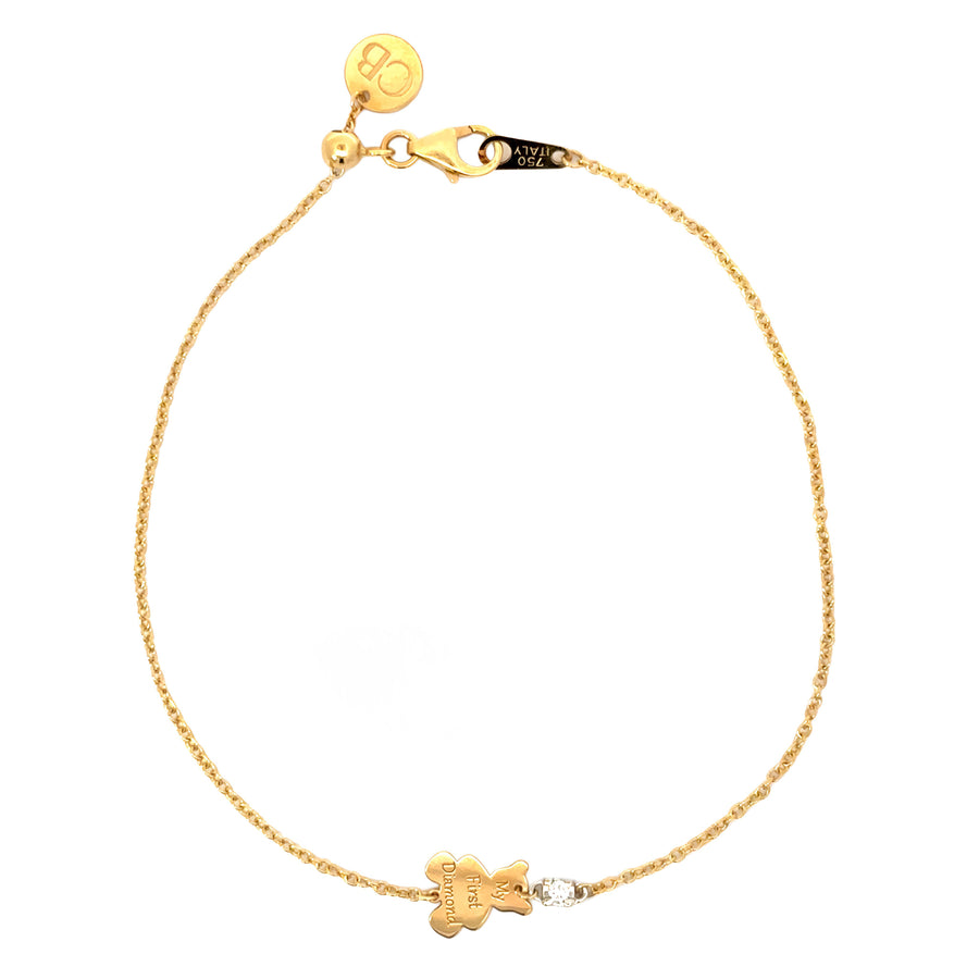 Close-up of sparkling diamond on 18k gold baby bracelet