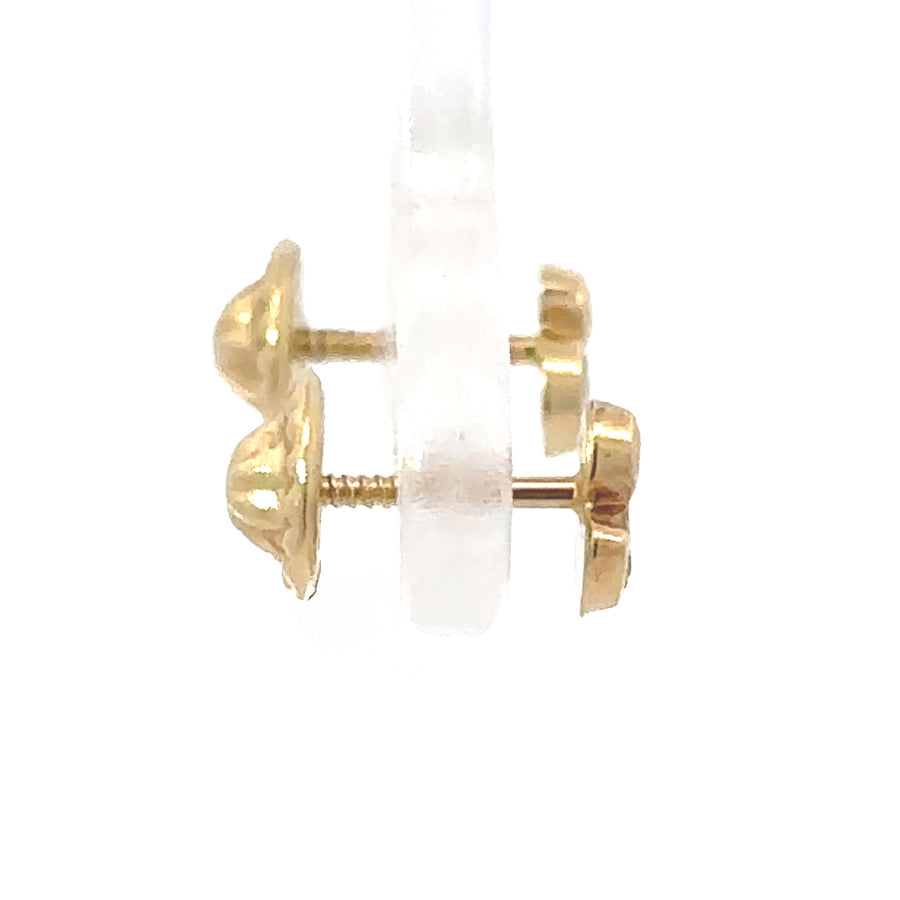 Close-up of gold duck earrings with sparkles for infants