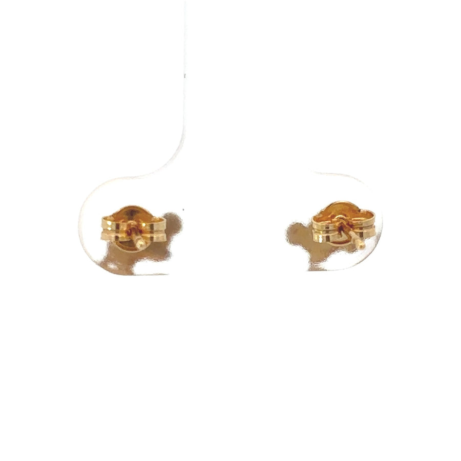 Pair of small 18k gold earrings displayed in jewelry box