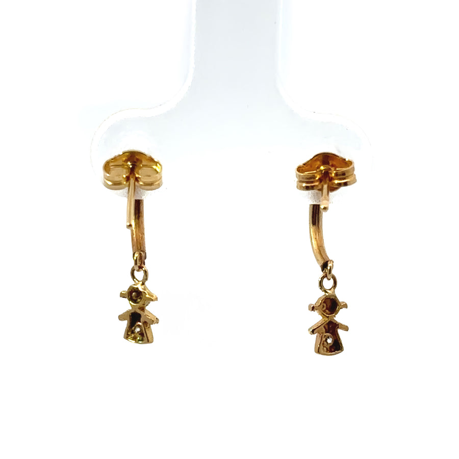 Secure backing on 18k gold baby earrings close-up
