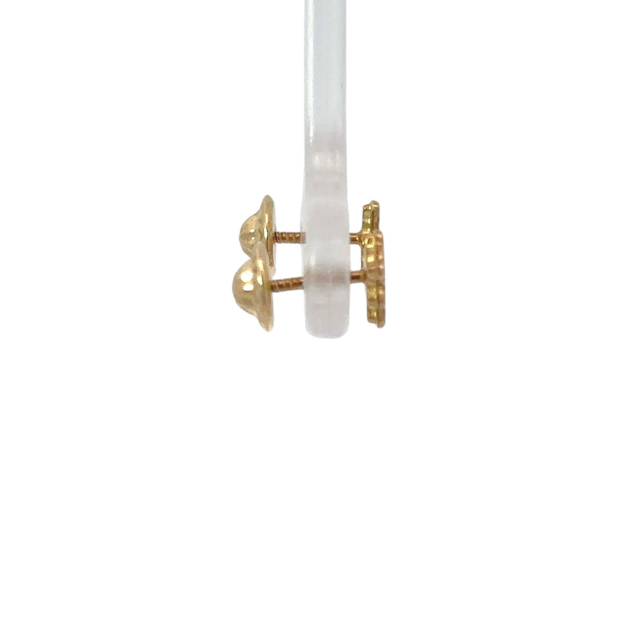 Pair of classic 18k gold baby earrings on white background