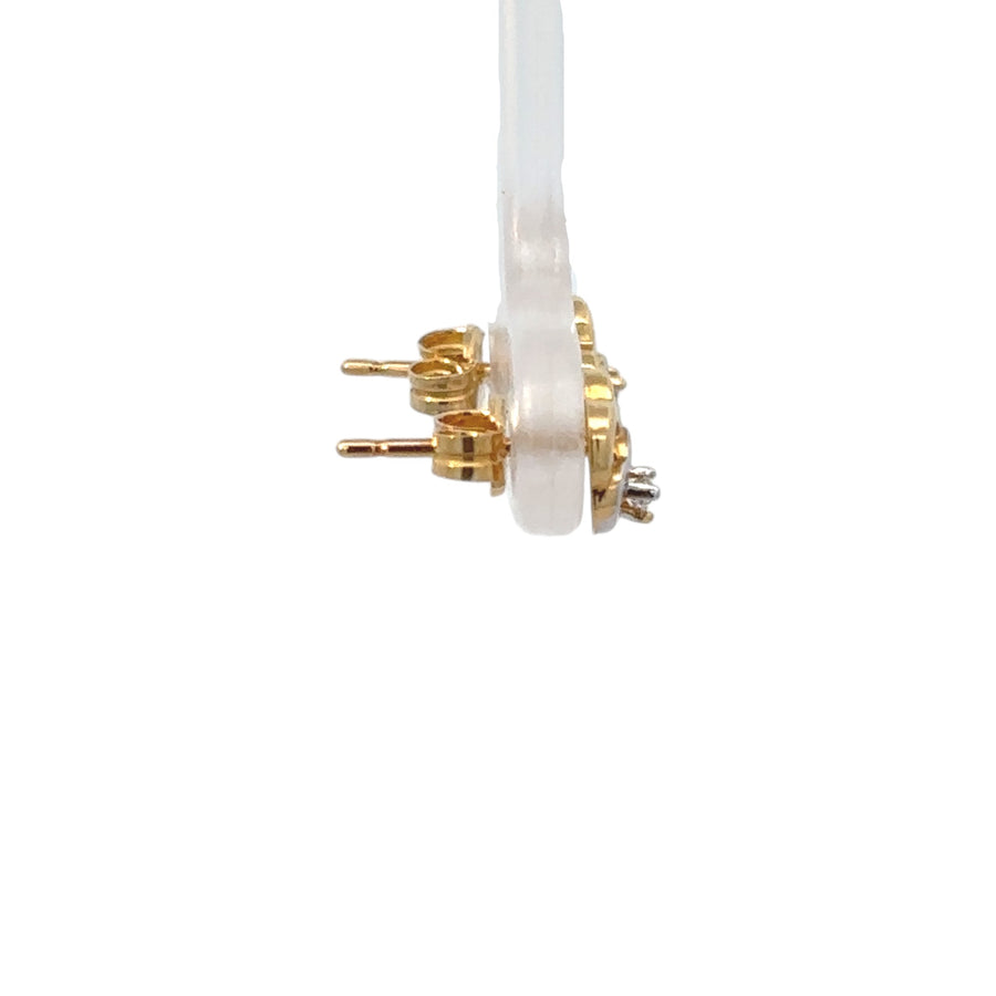 Lightweight 18k gold studs shaped as two hearts