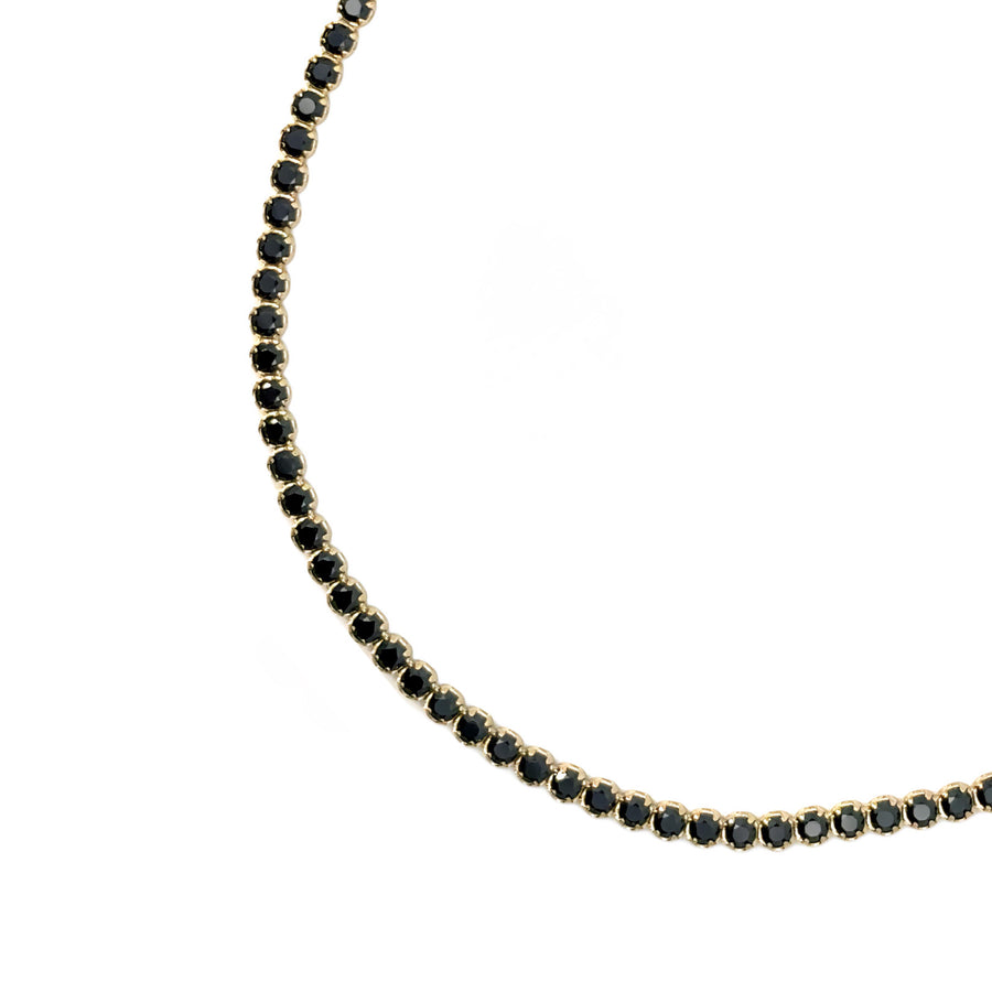 Sleek black onyx bracelet on delicate 18k gold chain