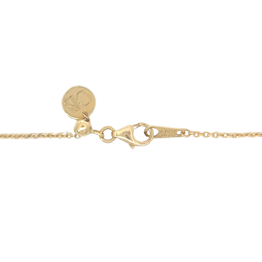 Model wearing 18k gold butterfly necklace styled with casual outfit