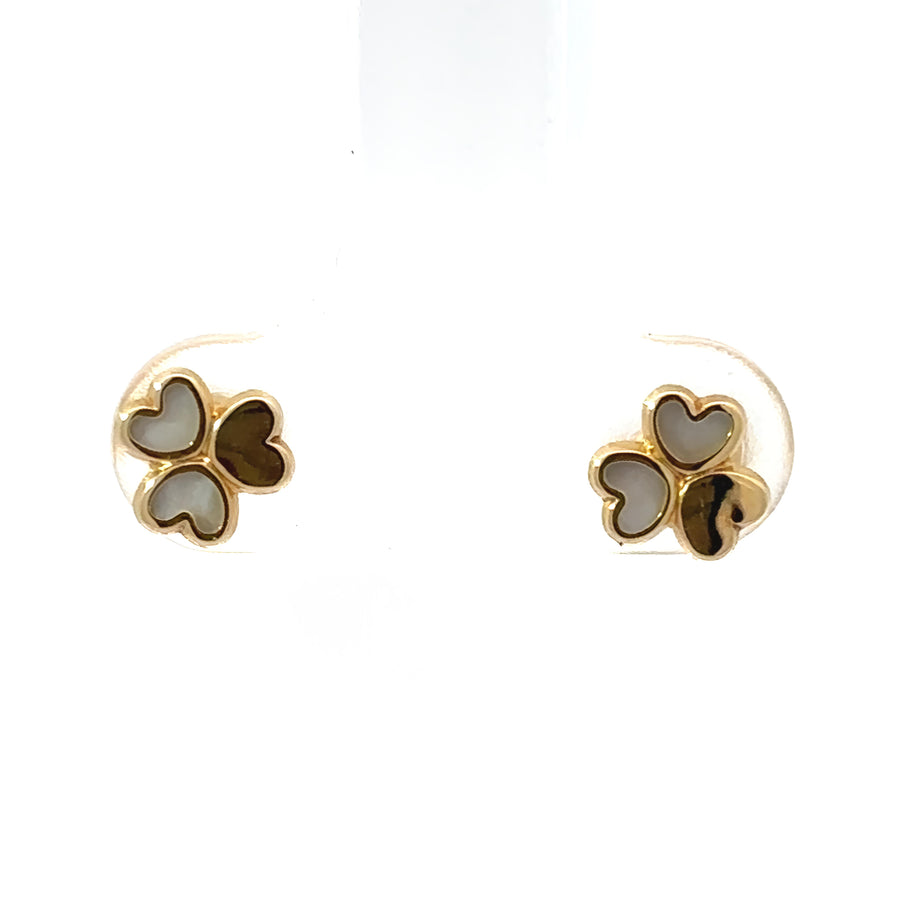 Close-up of 18k gold classic baby earrings with smooth finish