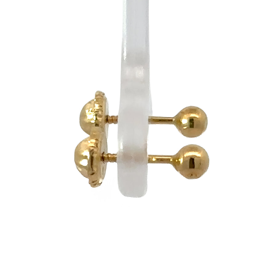 Baby wearing timeless 18k gold solid stud earrings