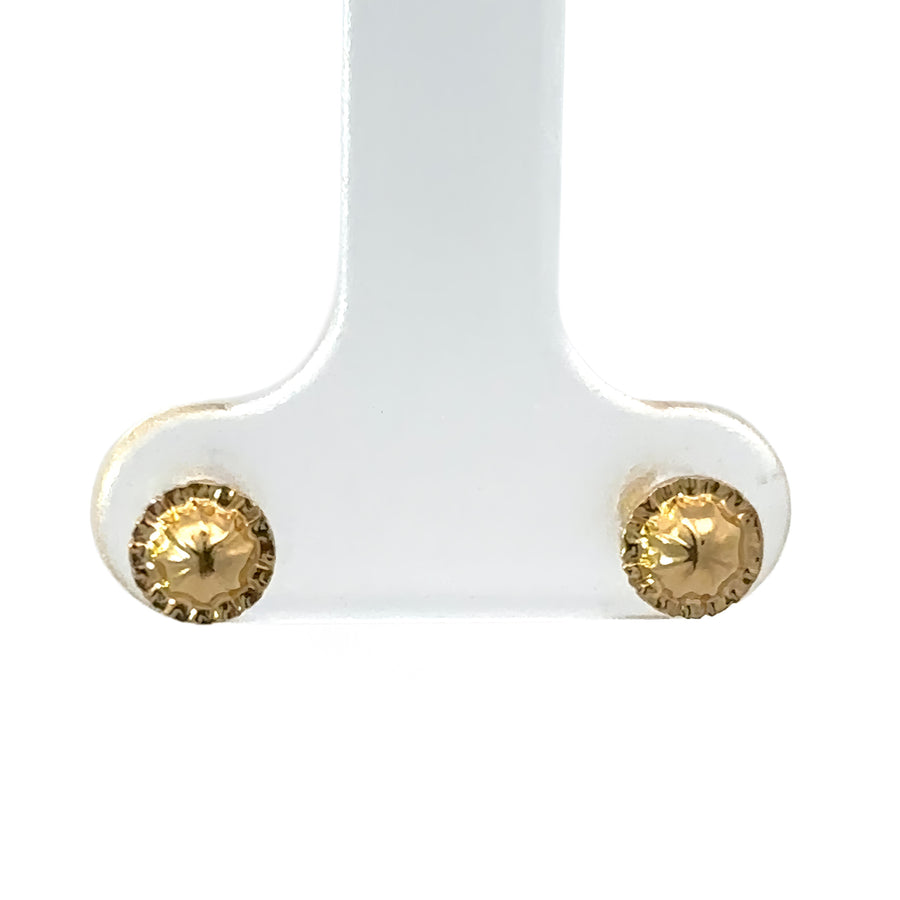 Pair of 18k gold solid studs displayed on white background