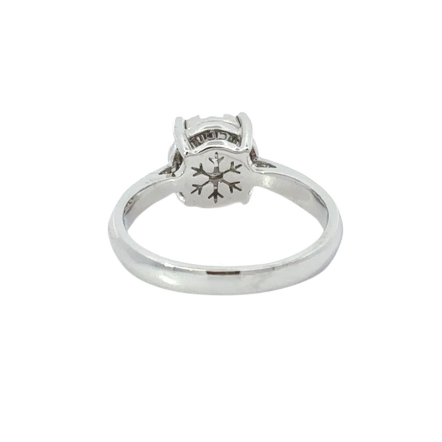 Woman’s hand wearing 18k gold diamond ring