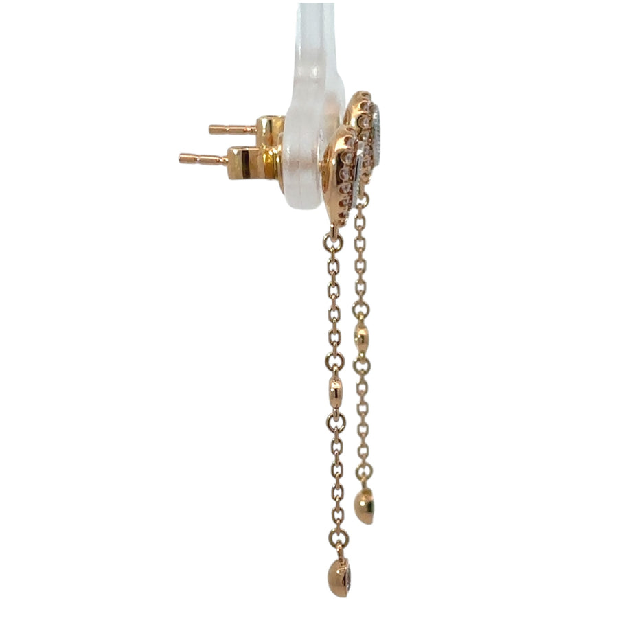 Close-up of elegant gold stud earrings with diamond center
