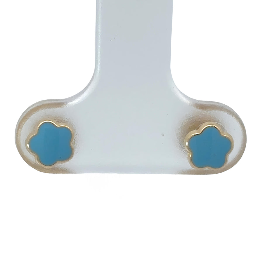 Close-up of 18k gold flower stud earrings on white background