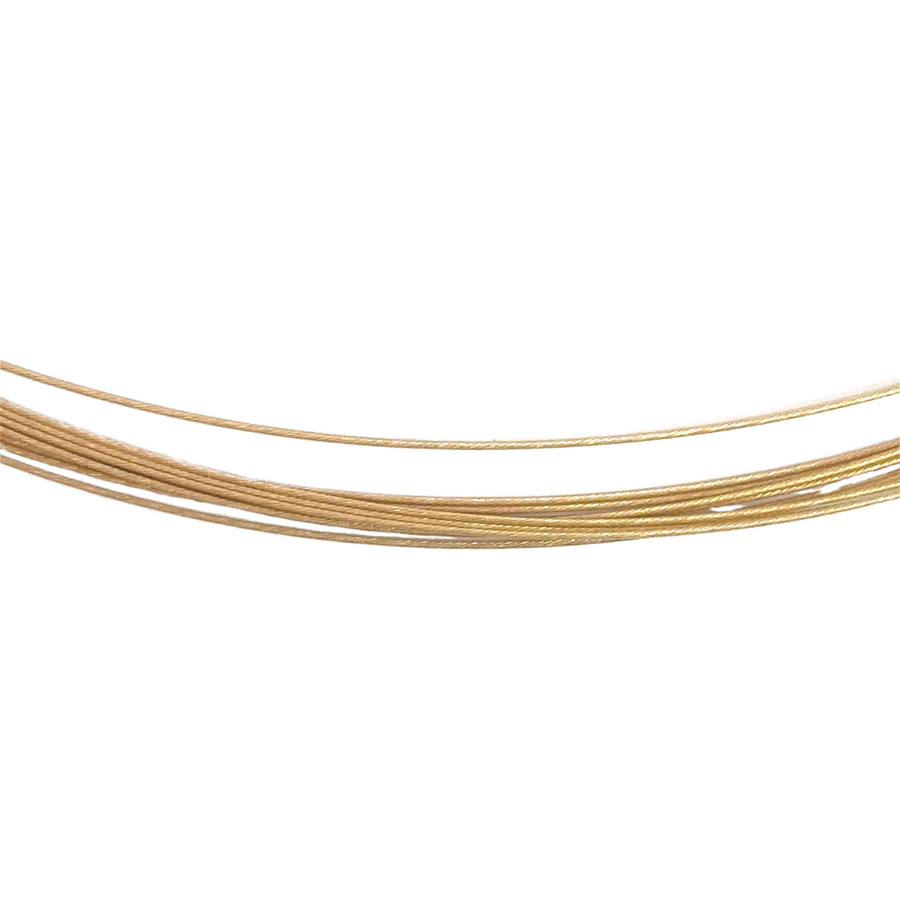 Close-up of 18k gold necklace clasp and links