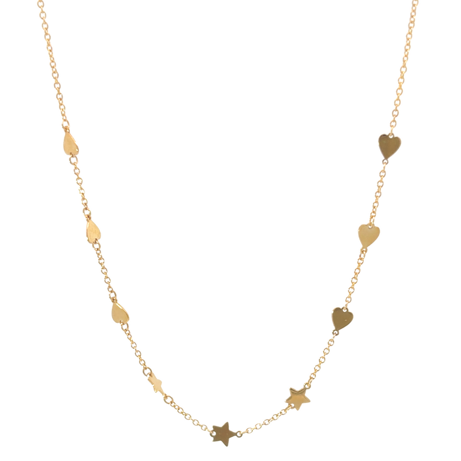 18k gold heart and star necklace laid flat on a soft background