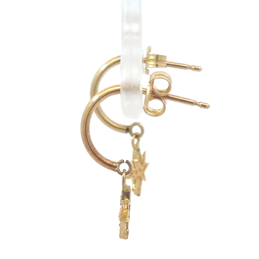Woman modeling the 18k gold hoop earrings, showcasing elegant everyday look