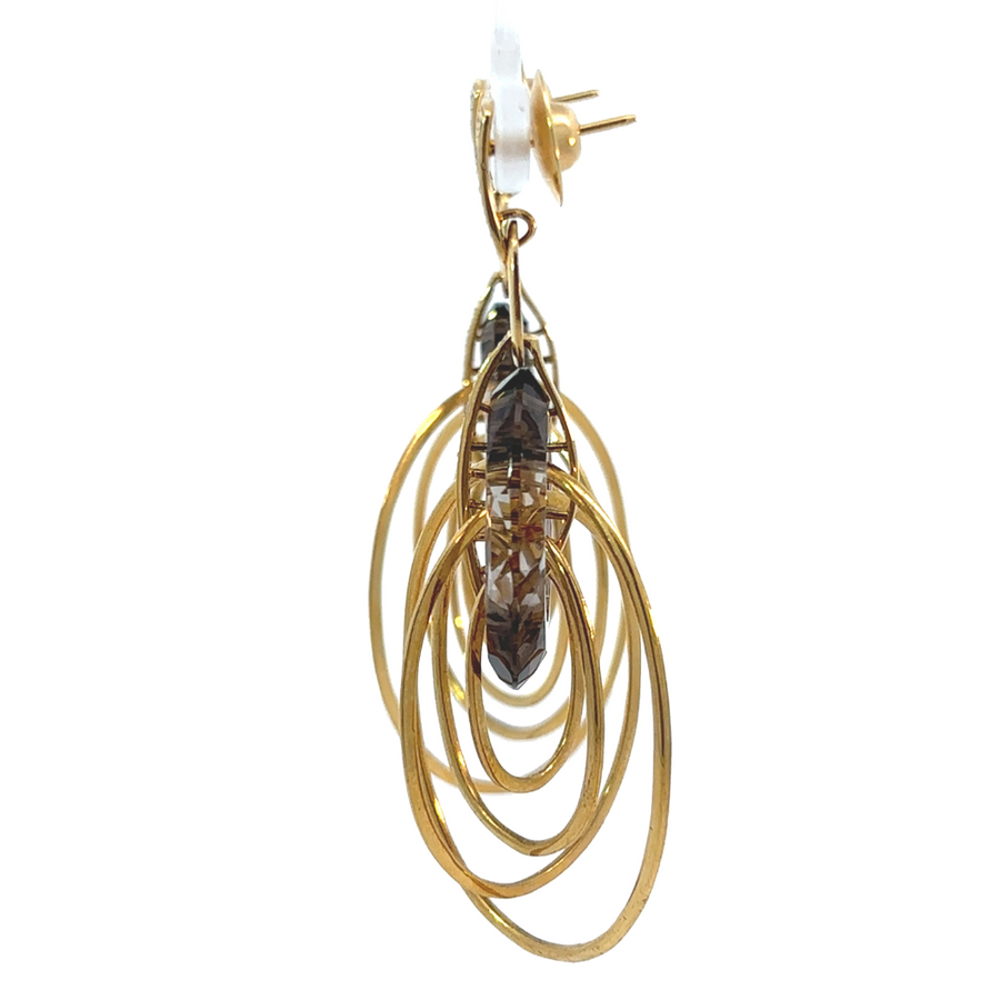 Elegant smoky quartz hoop earrings on neutral display stand