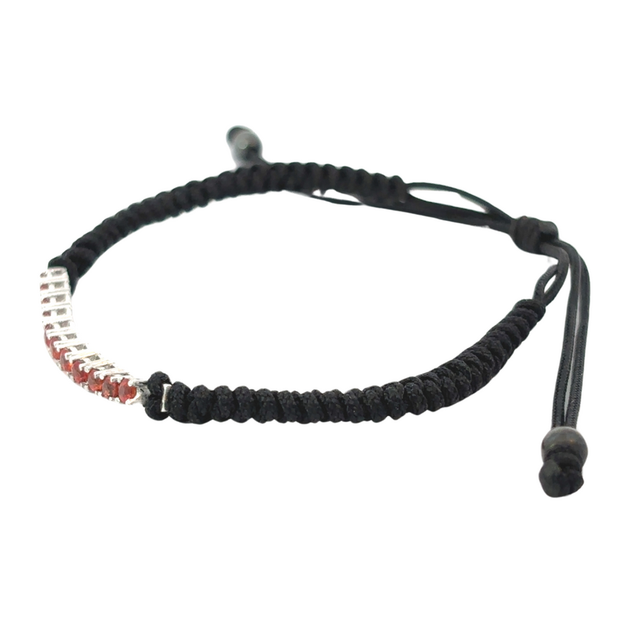 Detailed view of stone setting on gold macrame bracelet