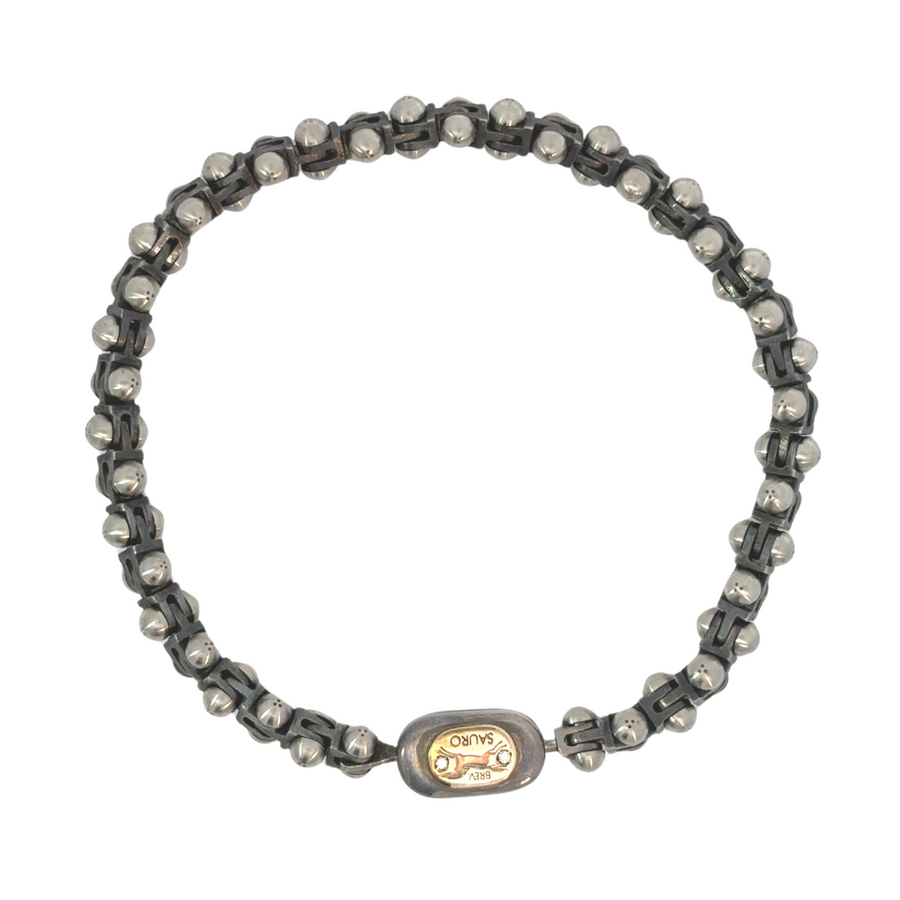 18k gold men’s bracelet with carbon silver and diamond on white surface