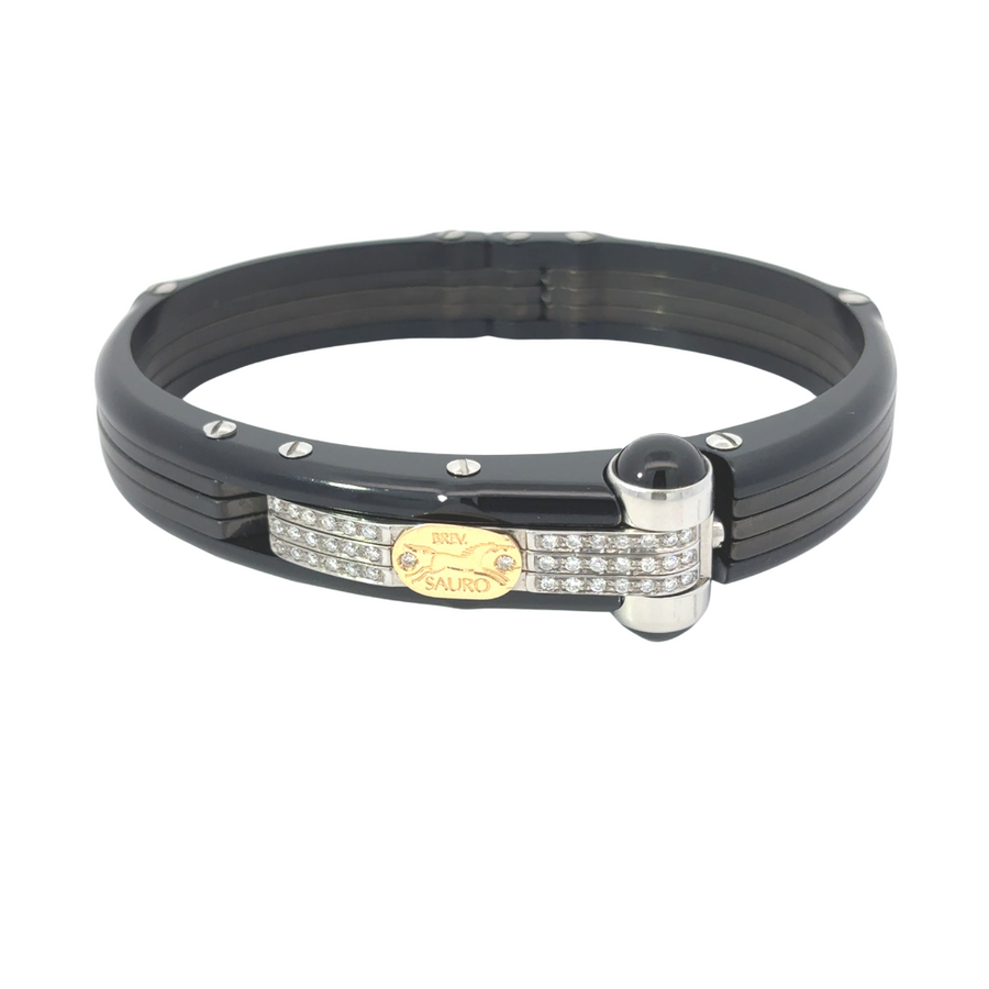 18k gold men’s bracelet with carbon and diamond accents on white background