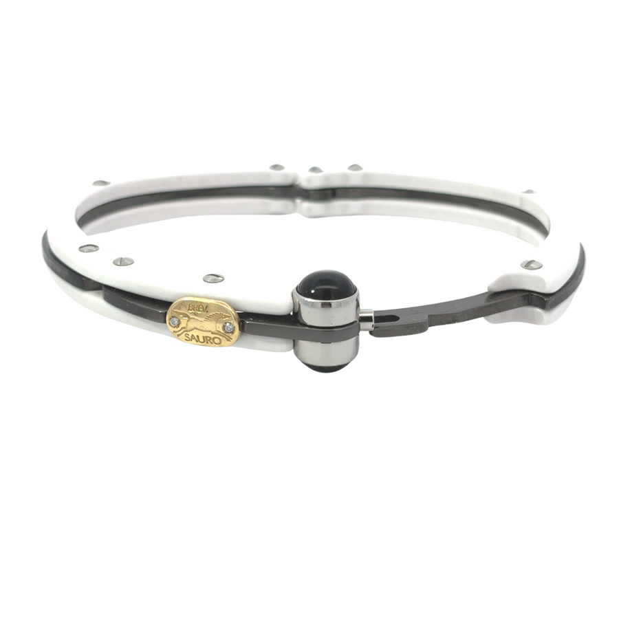 18k gold men’s bracelet with ceramic accents and diamond on white background