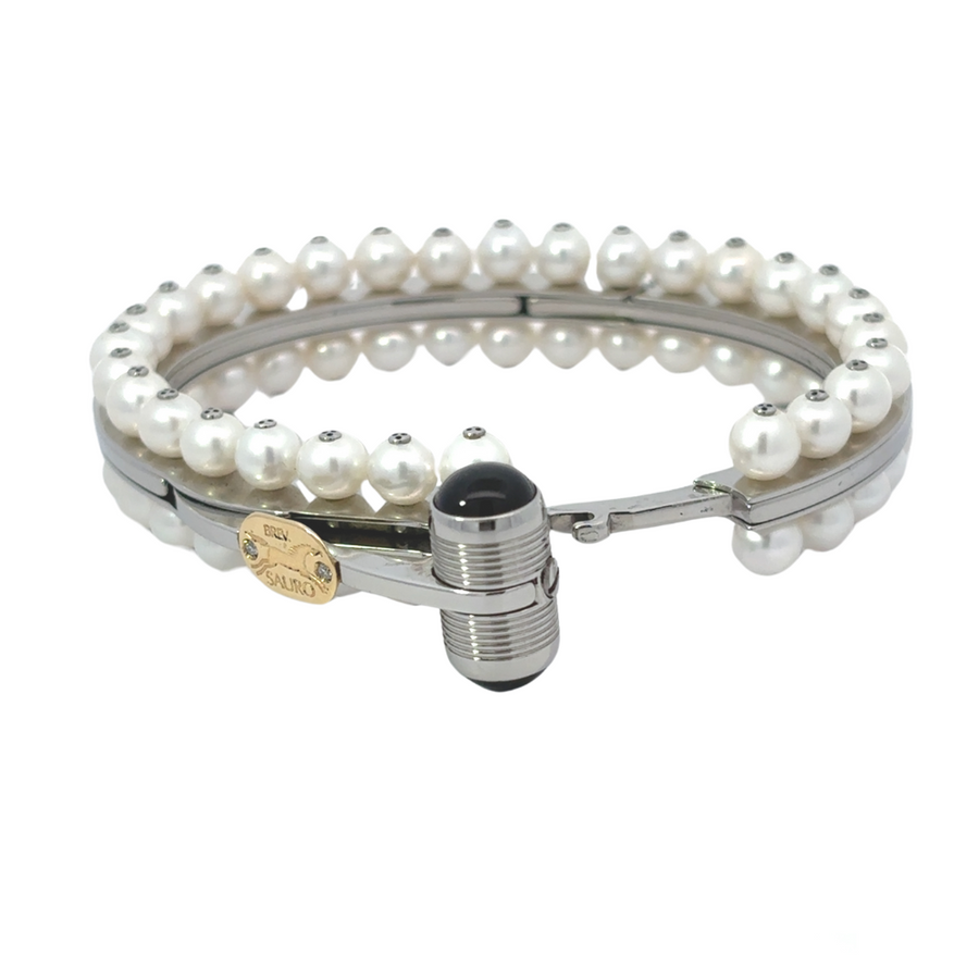 Bracelet shown flat to display its length and luxurious materials