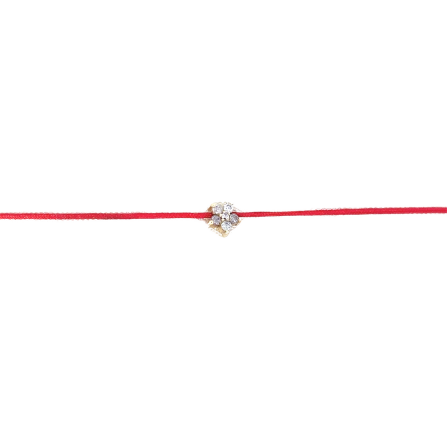 Woman wearing the 18k gold red bracelet, showcasing its adjustable fit and elegant design.