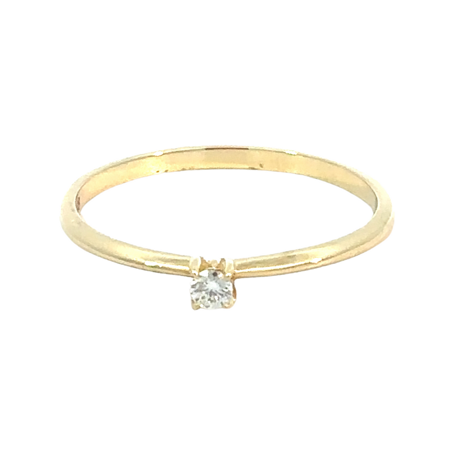 Women’s gold ring with center solitaire diamond