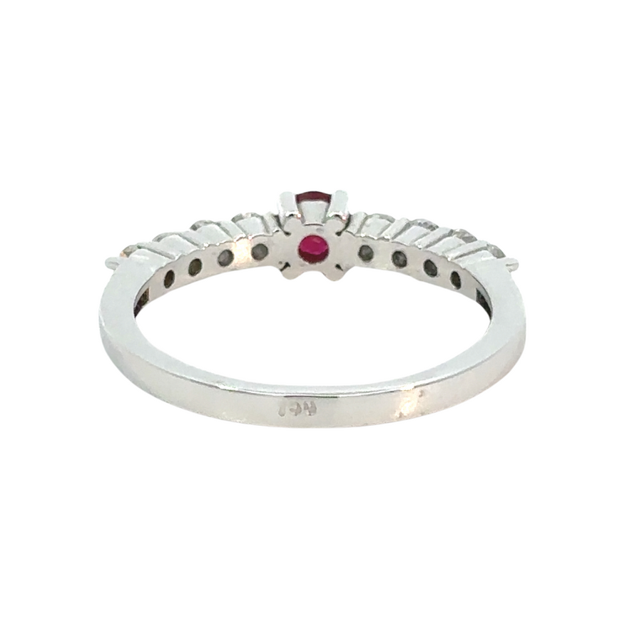 Detailed view of diamond accents around ruby center stone
