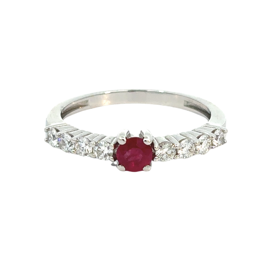 Close-up of ruby surrounded by diamonds in gold ring