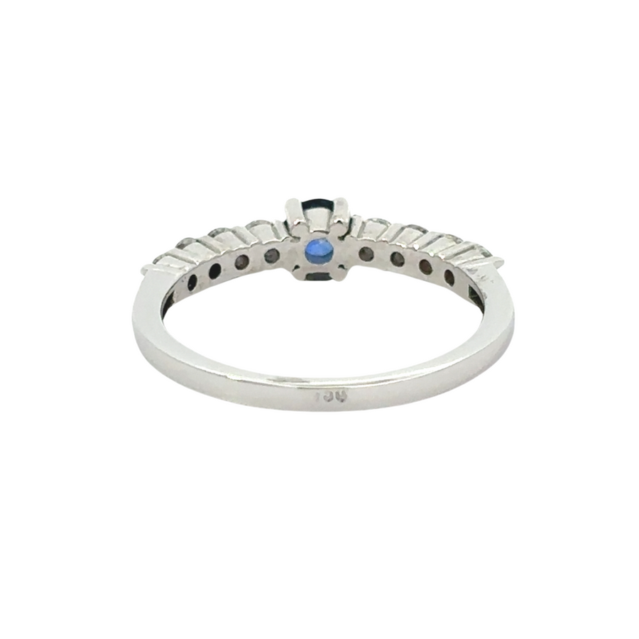 Detailed view of diamond accents around sapphire center stone
