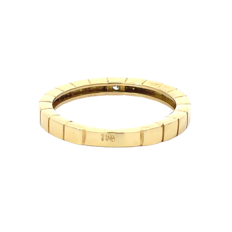 Close-up of white stone set in gold ring