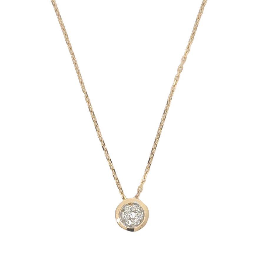 Delicate gold necklace with circle pendant and diamonds